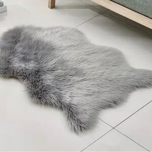 - NWT Grey faux fur area rug
